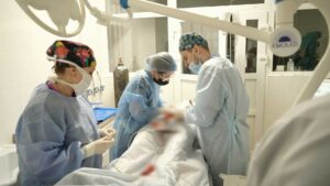 20 days in mariupol cinematography by evgeniy maloletka interior day medium close up three shot hard light sunlight shot 062