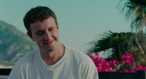 aftersun cinematography by gregory oke exterior day wide shot establishing shot hard light sunlight shot 051