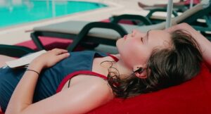 aftersun cinematography by gregory oke exterior day wide shot establishing shot hard light sunlight shot 059