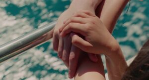 aftersun cinematography by gregory oke exterior day wide shot establishing shot hard light sunlight shot 072