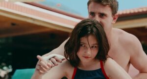 aftersun cinematography by gregory oke exterior day wide shot two shot hard light sunlight shot 048