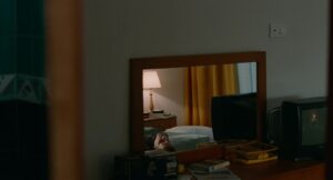 aftersun cinematography by gregory oke interior night medium close up soft light artificial light shot 024