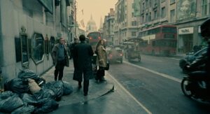children of men cinematography by emmanuel lubezki exterior day medium wide shot three shot backlight daylight bus shot 036