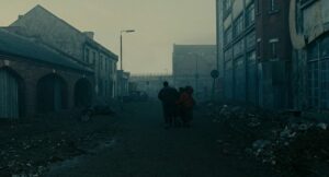 children of men cinematography by emmanuel lubezki exterior day wide shot two shot backlight shot 071