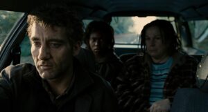 children of men cinematography by emmanuel lubezki night extreme close up three shot silhouette artificial light shot 068