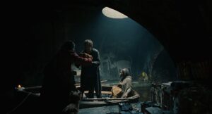 children of men cinematography by emmanuel lubezki night medium shot three shot artificial light shot 039