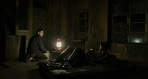 children of men cinematography by emmanuel lubezki night medium wide shot artificial light shot 061