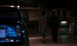 in the mood for love cinematography by christopher doyle exterior night medium wide shot two shot artificial light shot 026