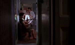 in the mood for love cinematography by christopher doyle interior night medium shot over the shoulder artificial light shot 023