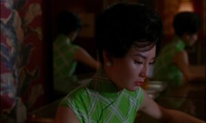 in the mood for love cinematography by christopher doyle night extreme close up over the shoulder artificial light shot 071