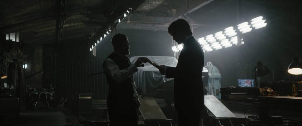 the batman cinematography by greig fraser interior medium shot two shot side lighting artificial light shot 060
