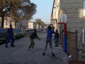 hoop dreams cinematography by peter gilbert exterior day medium wide shot three shot backlight daylight car shot 054