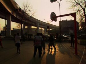 hoop dreams cinematography by peter gilbert exterior day medium wide shot three shot backlight shot 005