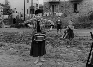 la strada cinematography by otello martelli exterior day medium close up three shot daylight shot 026