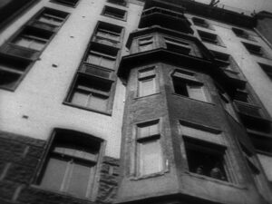 man with a movie camera cinematography by mikhail kaufman day establishing shot side lighting daylight shot 041