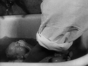 man with a movie camera cinematography by mikhail kaufman day extreme close up side lighting daylight shot 055