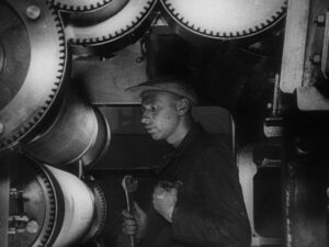 man with a movie camera cinematography by mikhail kaufman day medium close up backlight shot 056