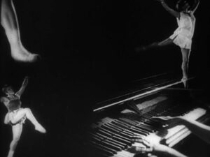 man with a movie camera cinematography by mikhail kaufman night medium shot two shot silhouette artificial light shot 046