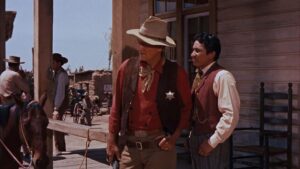 rio bravo cinematography by russell harlan exterior day medium close up three shot side lighting shot 031