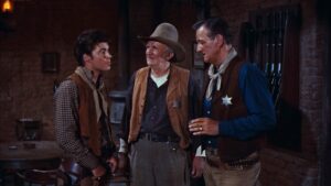 rio bravo cinematography by russell harlan interior night medium close up three shot artificial light shot 018