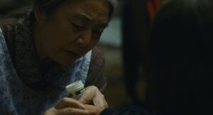 shoplifters cinematography by ry to kond night extreme close up artificial light shot 043