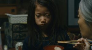 shoplifters cinematography by ry to kond night extreme close up over the shoulder artificial light shot 068