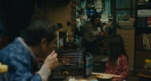 shoplifters cinematography by ry to kond night medium close up over the shoulder artificial light shot 021