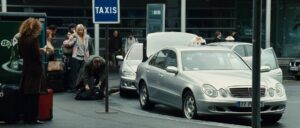 taken cinematography by michel abramowicz exterior day medium wide shot three shot backlight car shot 027