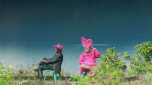 the act of killing cinematography by lars skree day medium wide shot two shot hard light daylight shot 038