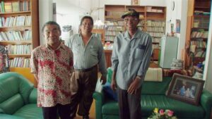 the act of killing cinematography by lars skree interior day medium close up three shot hard light daylight shot 048