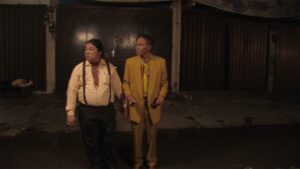 the act of killing cinematography by lars skree interior night medium shot two shot artificial light shot 068